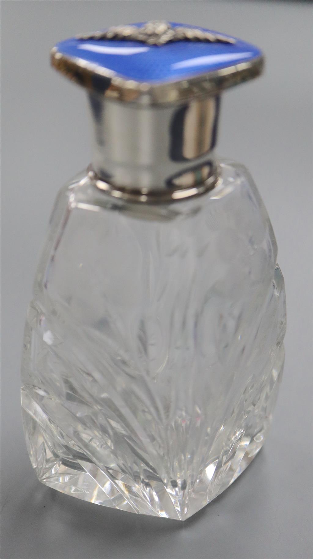 A George V silver and blue guilloche enamel mounted cut glass scent bottle, with R.A.F. applique, Birmingham, 1930, 10.8cm